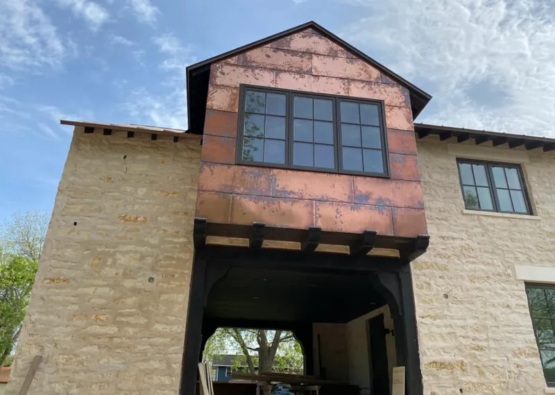 Copper metal panel facade on a stone building for Skylight Installation in Rolling Meadows