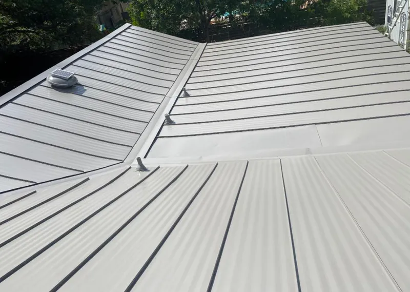 Solar attic fan installed on a metal roof for Roof Ventilation in Rolling Meadows